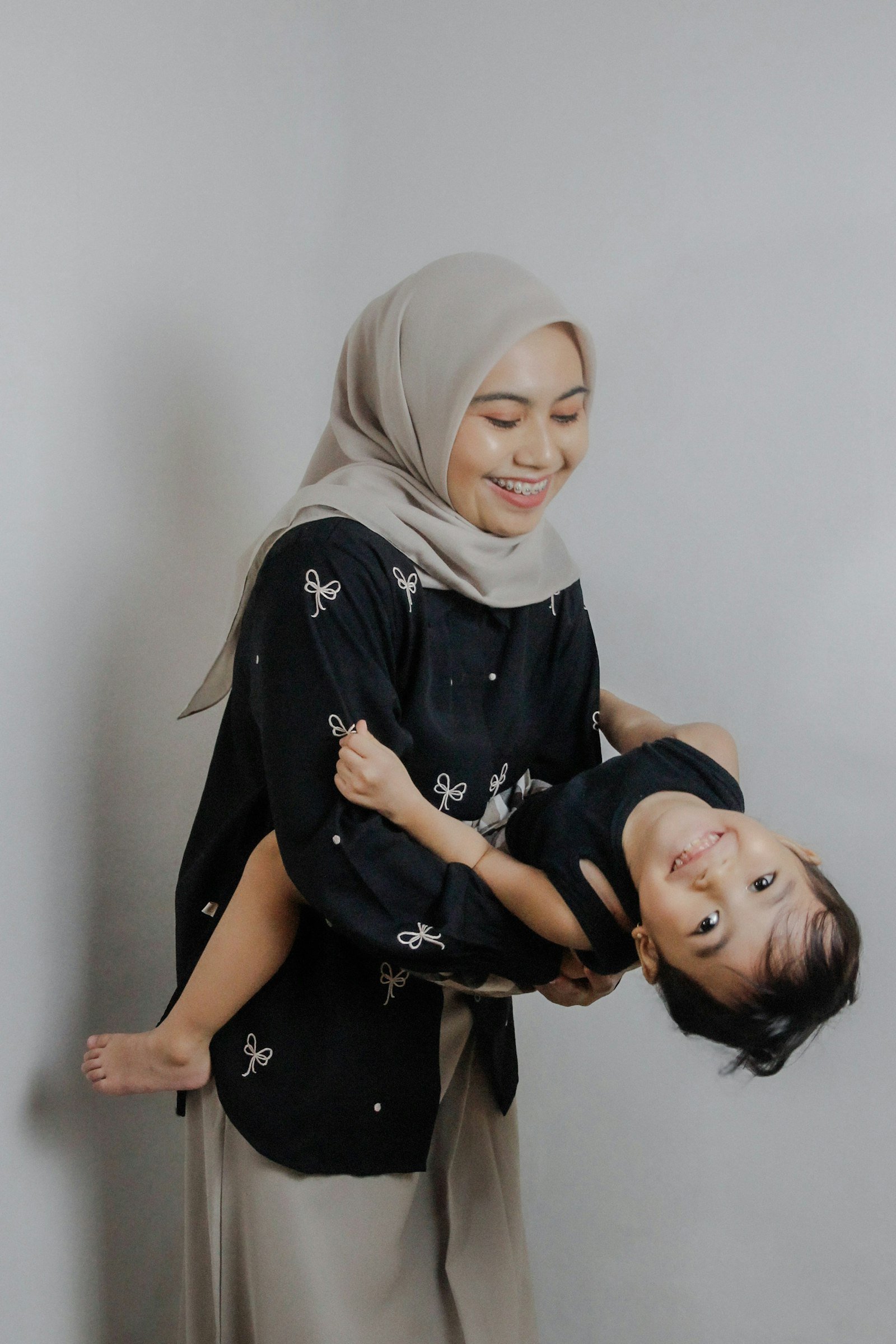 A mother laughing with her son
